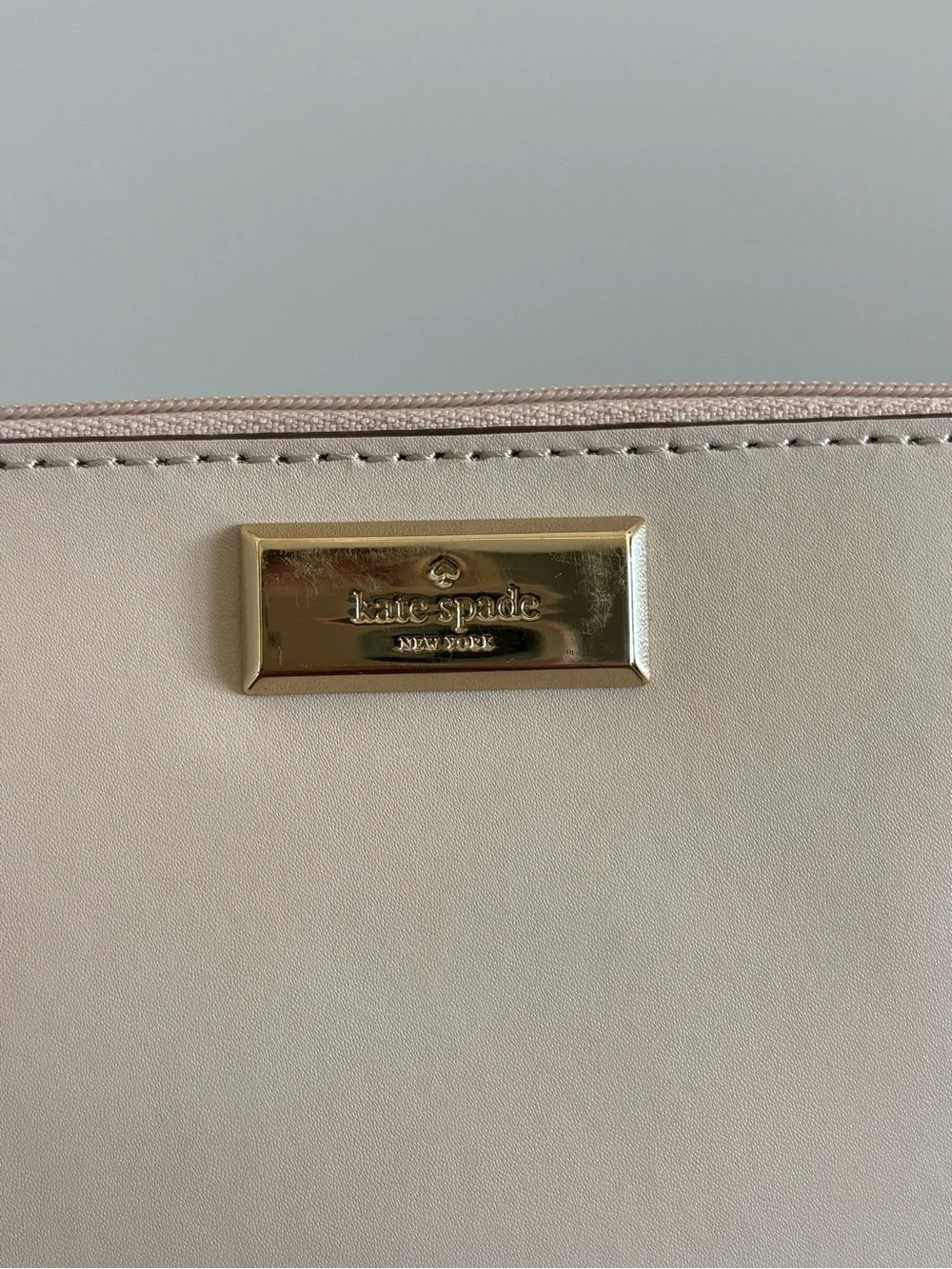 kate spade Cream Leather Wristlet with Gold Plate